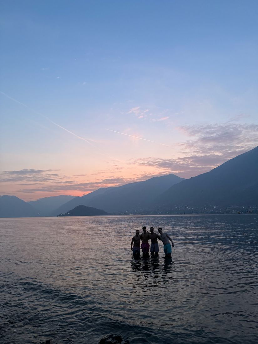 Swimming at sunset with friends
